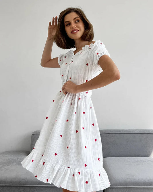 Amore - Hochtailliertes Kleid mit Puffärmeln und Herzmotiv